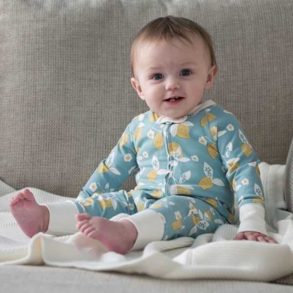 Baby wearing lemon pattern romper