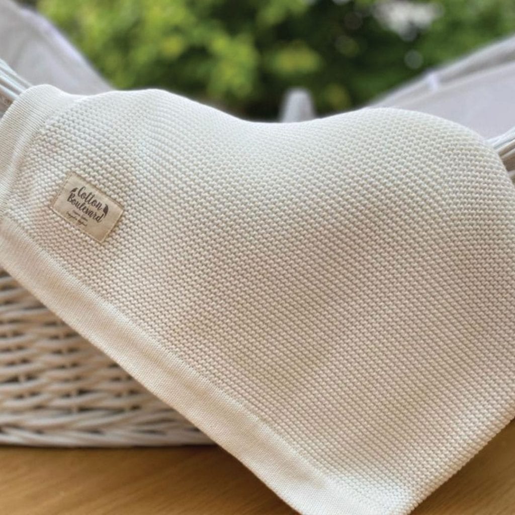 White Organic Cotton Blanket in basket