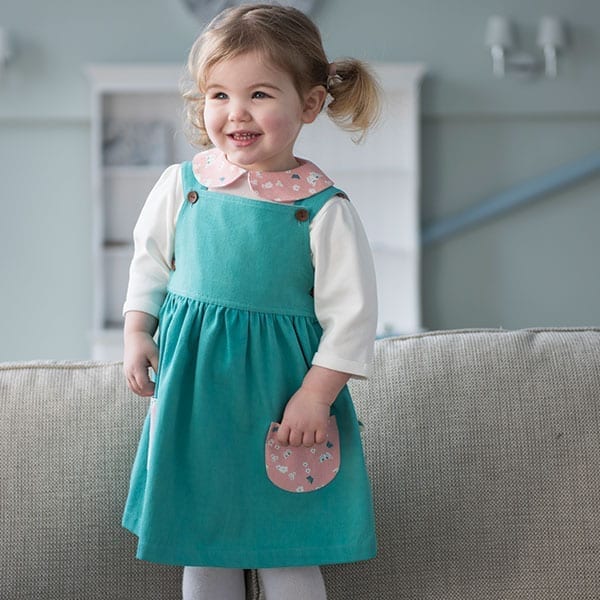 Girl in Dark Green Twill Butterfly Pocket Pinafore